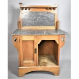 An Arts and Crafts Oak Wash Stand with Marble Top and Raised Galleried Back having Open Display