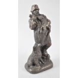 A Resin Figure Group Depicting Shepherd Bottle Feeding Lamb with Dog by His Side, 22cms High