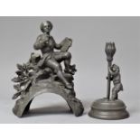 A Small Continental Pewter Novelty Candle Stick in the Form of Tulip Tended by Pixie together with a