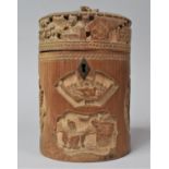 A Chinese Cylindrical Bamboo Tea Caddy with Intricately Carved Cartouches Depicting Birds and Seated