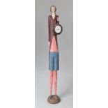 A Modern Carved Wooden Novelty Clock Stand in the Form of an Elongated Figure, 79cms High