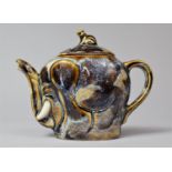 A Glazed Novelty Teapot In the form of an Elephant with Monkey Finial, 12cm high