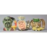 Three Royal Doulton Character Jugs, The Genie, March Hare and Cook and Cheshire Cat