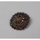 A Circular Garnet Set Brooch, 3cm high