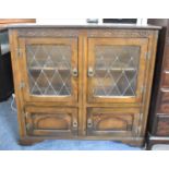 A Mid 20th Century Glazed Side Cabinet with Cupboard Base, 107cm wide