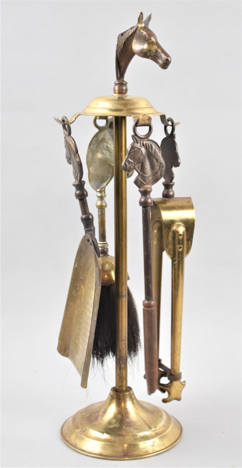 A Mid 20th Century Brass and Iron Companion Set with Horses Head Decoration, 42.5cm High