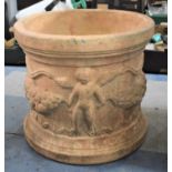 A Modern Cast Terracotta Circular Patio Planter Decorated in Relief with Swags and Cherubs, 44cm