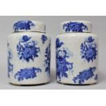 A Pair of Blue and White Grackle Glazed Floral Transfer Decorated Lidded Ginger Jars, 16cm high