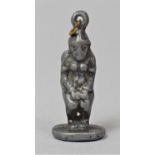 A Late 19th/Early 20th Century White Metal Pendant in the Form of a Crouching Figure, Possible