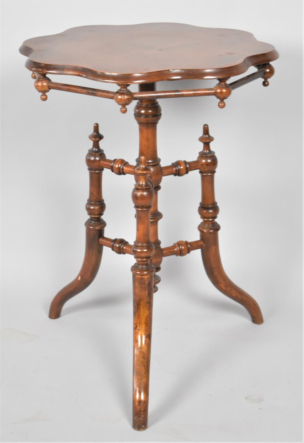 An Oriental Shaped Circular Topped Occasional Table on Tripod Base with Turned Stretchers, 49cm