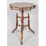 An Oriental Shaped Circular Topped Occasional Table on Tripod Base with Turned Stretchers, 49cm