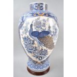 A Modern Oriental Blue, White and Gilt Vase on Wooden Circular Stand, 41cm high