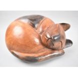 A Large Carved Wooden Study of a Curled Sleeping Cat, 28cm Wide