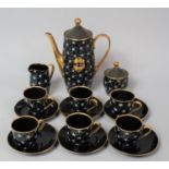 A 1960s Polish Black and Gilt Decorated Coffee Set with Applied Blue and white Enamels Star