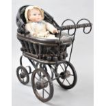 A Reproduction Victorian Style Dolls Pram Containing Small Doll, 30cm Wide