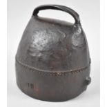 A Handworked and Riveted Cowbell Stamped IHL, 14cm high