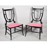 A Pair of Edwardian Ebonised Shield back Ladies Nursing Chairs