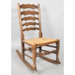 A Rush Seated Ladder Back Rocking Chair