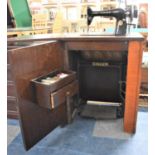 An Oak Cased Singer Treadle Sewing Machine