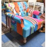 A Buttoned Upholstered Arm Chair