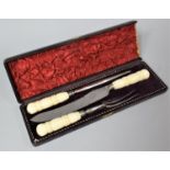 A Late Victorian Boxed Carving Set having Turned Bone handles and Silver Banding (Case AF)