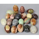 A Collection of Various Onyx Eggs and Two Onyx Egg Cups