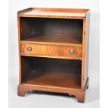 A Galleried Walnut Two Division Bookcase with Centre Drawer, 50cm Wide