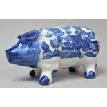 A Blue and White Willow Pattern Piggy Bank, 25cm Long