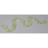 A Jade Bead Necklace, 72 cms long