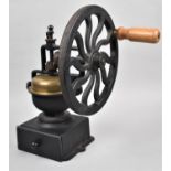A Cast Iron Brass Mounted Coffee Grinder with Single Drawer and Wooden Handle. 33.5cm high