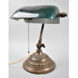 An Edwardian Brass Adjustable Desk Top Reading Light with Opaque Green Glass Shade, Some Losses