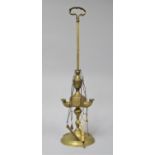 A Brass Three Branch Temple Oil Lamp with Chains Supporting Snuffer, Tweezers, Candlesnips etc, 50cm