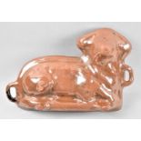 A French Glazed Terracotta Cooking Mould in the Form of a Reclining Lamb, 37cm Wide