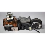 A Collection of Vintage 33mm Cameras, 8mm Movie Camera, Polaroid etc