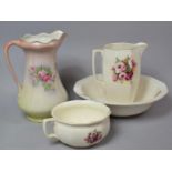 A Rose Toilet Set to comprise Toilet Bowl, Wash Bowl and Jug together with a Floral Decorated Jug