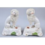 A Pair of Early/Mid 19th Century Staffordshire Figures of Seated Poodles, 11cm high