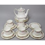 A Paragon Belinda Pattern Tea Set to comprise Teapot, Four Cups, Milk Jug, Six Saucers, Six Side