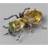 A Novelty Ladies Brooch in the Form of a Insect Formed From Citrine and Silver with Green Stone Eyes