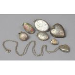 A Collection of Various Silver Lockets to Include Oval Heart Shaped and Circular Examples