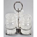 An Edwardian Silver Plated Three Section Bottle Stand with Three Glass Bottles, 26cm high