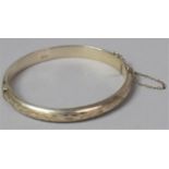 A Silver Bangle with Safety Chain, Birmingham 1974, Engraved Decoration