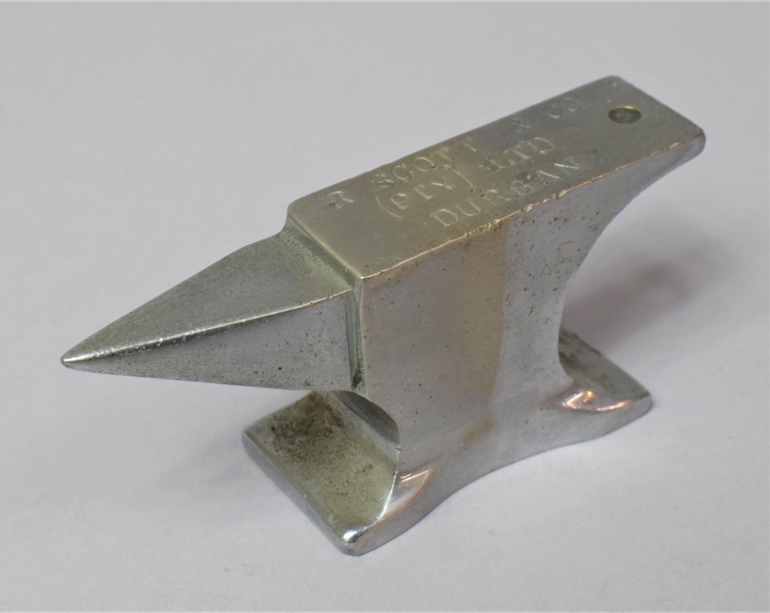 A Novelty Desktop Paperweight in the Form of an Anvil Inscribed R Scott & Co (PTY) Ltd, Durban, 9.