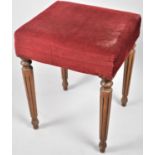 A Mid 20th Century Upholstered Stool with Turned Reeded Supports, 38cm wide