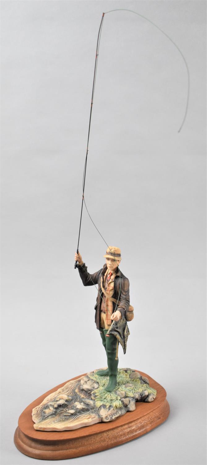 A Border Fine Arts Study of a Fly Fisherman, Model No.110 by David Geenty on Oval Wooden Base