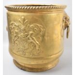 A Mid 20th Century Pressed Brass Cylindrical Coal Bucket with Lion Mask Ring Handles and Armorial