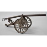A Vintage Brass and Metal Toy Cannon, 25cm Long