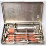 A WWII Metal Cased Surgeons Chest Aspiration Set by J Weiss and Son, London, 23cm Wide, War