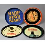 A Collection of Five Circular Pressed Metal Guinness and Harp Lager Drinks Trays
