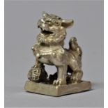 A Small Oriental white Metal Seal in the form of a Temple Dog