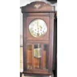 An Edwardian Oak Wall Clock with Eight Day Movement